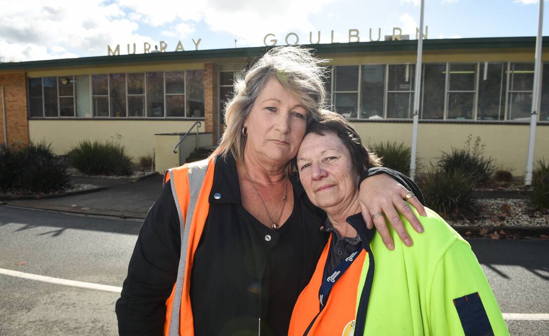 Sad day: Cleaners Freddie Dixon and Brenda Cooke outside the Murray Goulburn offices which they tidied before losing their jobs as part of cuts at the Kiewa dairy. Picture: MARK JESSER