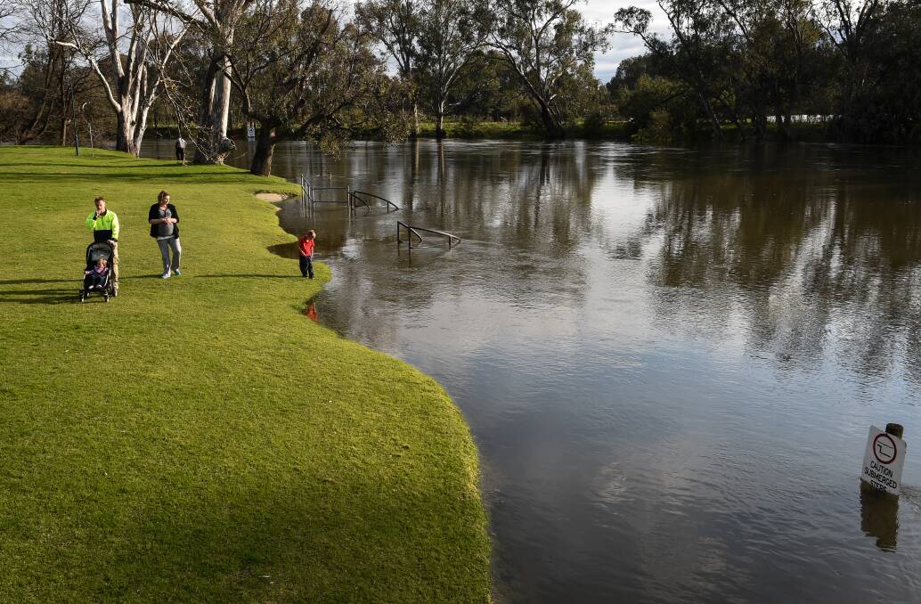 Wide load: The steps at Noreuil Park's foreshore in Albury are swamped by water which has risen due to Lake Hume releases increasing markedly since Sunday. 
