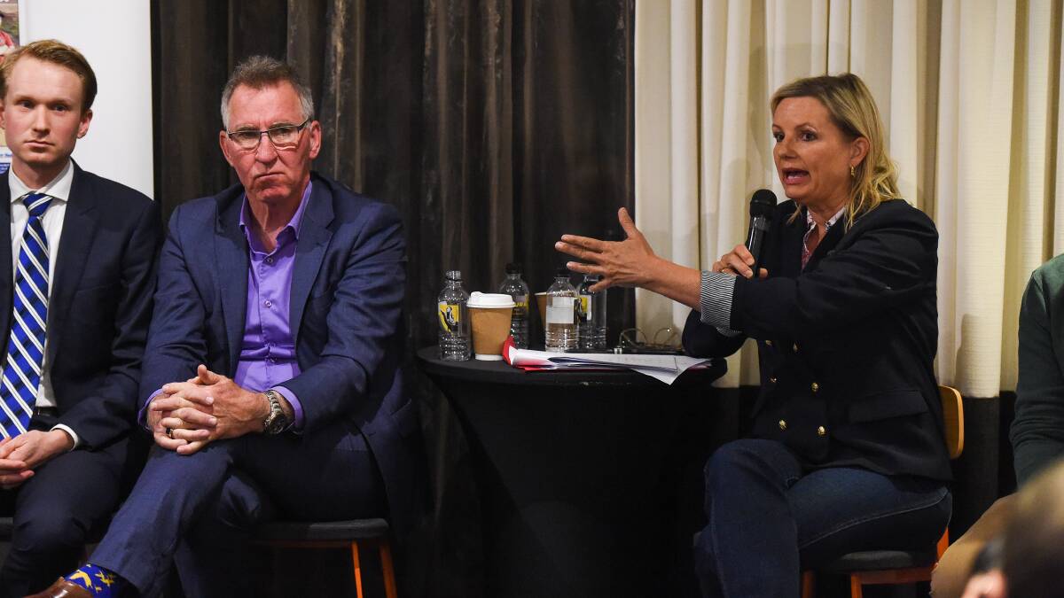 Combatants: Sussan Ley makes a point as Sustainable Australia candidate Ross Hamilton and Independent Kevin Mack listen. Picture: MARK JESSER