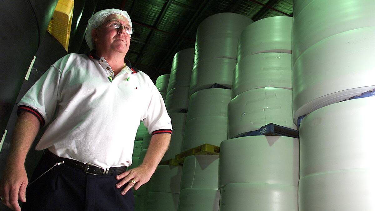 Yesteryear: Ray Butchart at the then Huhtamaki factory in 2002 with rolls of polystyrene that was formed into food containers.