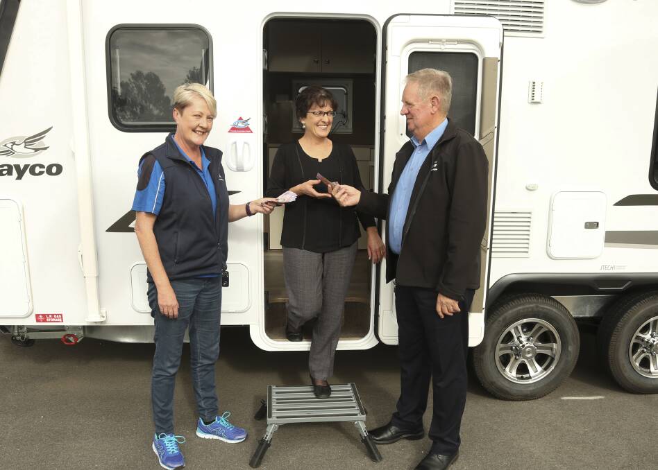 On the move: Jayco employee Ange Parkhill with the Border Trust's Amanda Solly and her boss Michael Houlihan. Picture: ELENOR TEDENBORG
