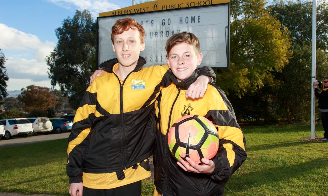 AT HOME: Albury West Public School captain Will Eden, who has Asperger's syndrome, with his mate Jacob Horne.  Picture: SIMON BAYLISS 