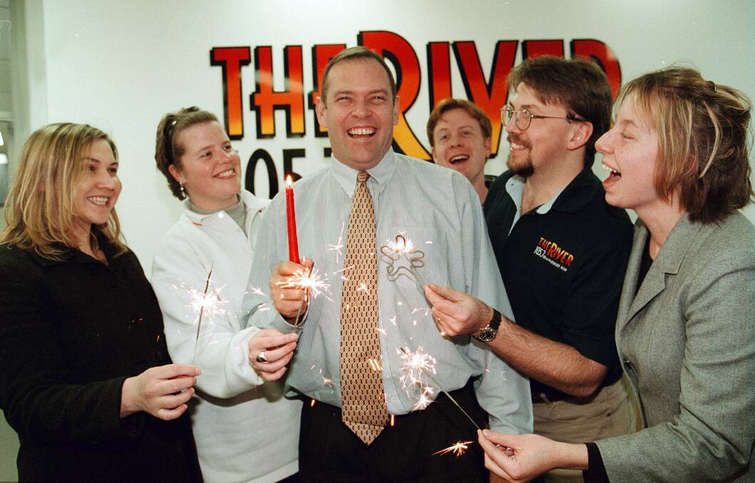 Happy days: Andy Walker (centre) with staff celebrate the first birthday of The River radio station in July 1999.