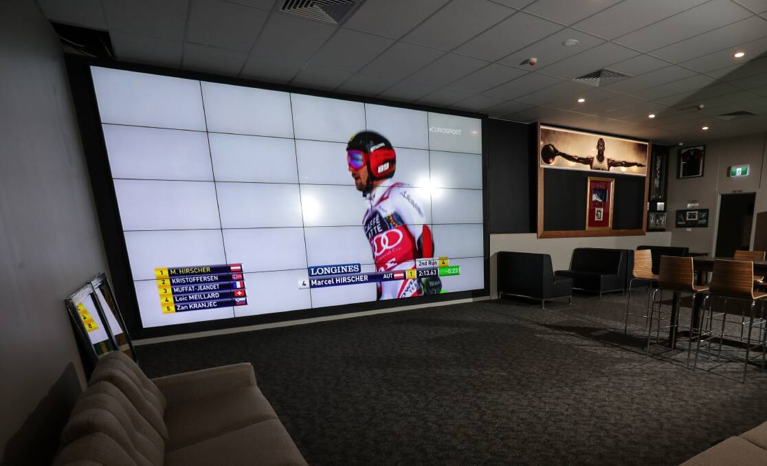 Wall display: The giant screen and Michael Jordan boot to the right of it which feature in the rear of The Circuit Sports Cafe. Picture: JAMES WILTSHIRE