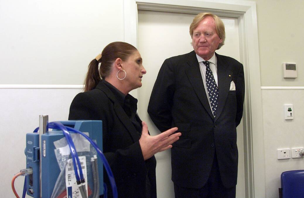 Helping hand: Bush nursing centre chief executive Sandi Grieve speaks to Ron Walker at the opening of the redeveloped Walwa hospital in 2006.