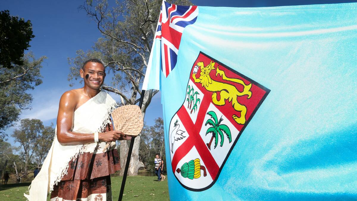 Flying the flag: Suva resident Mosese Tui, who has played mixed netball at the deaf games, carried the Fijian flag at the opening of Albury's Australia Day celebrations. Picture: KYLIE ESLER 