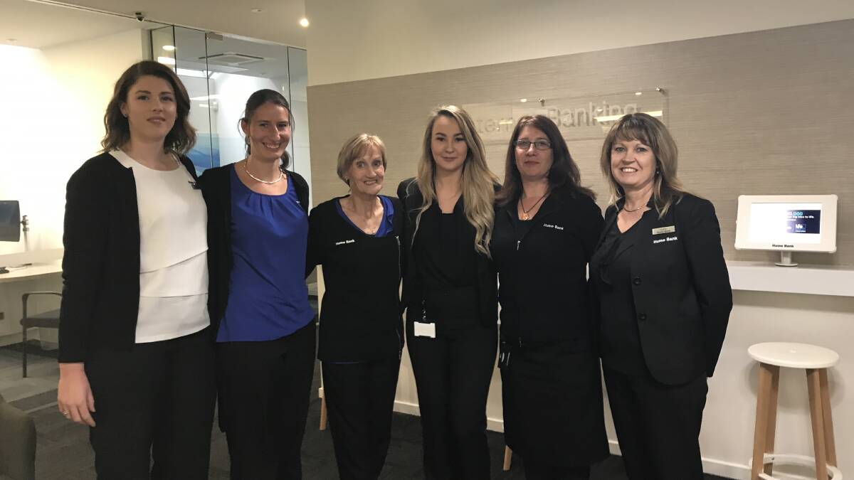 On call: Hume Bank's Krista Smith, Jessica Scheidat, Peta-Gai Roberts, Shae Potter, Naomi McCormack, Cathy Clark are working in the new dedicated contact centre.