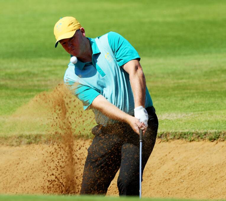 Sand blast: Marcus Fraser hits out of a bunker on the 11th hole of Rio's Olympic course. PIctures: GETTY IMAGES