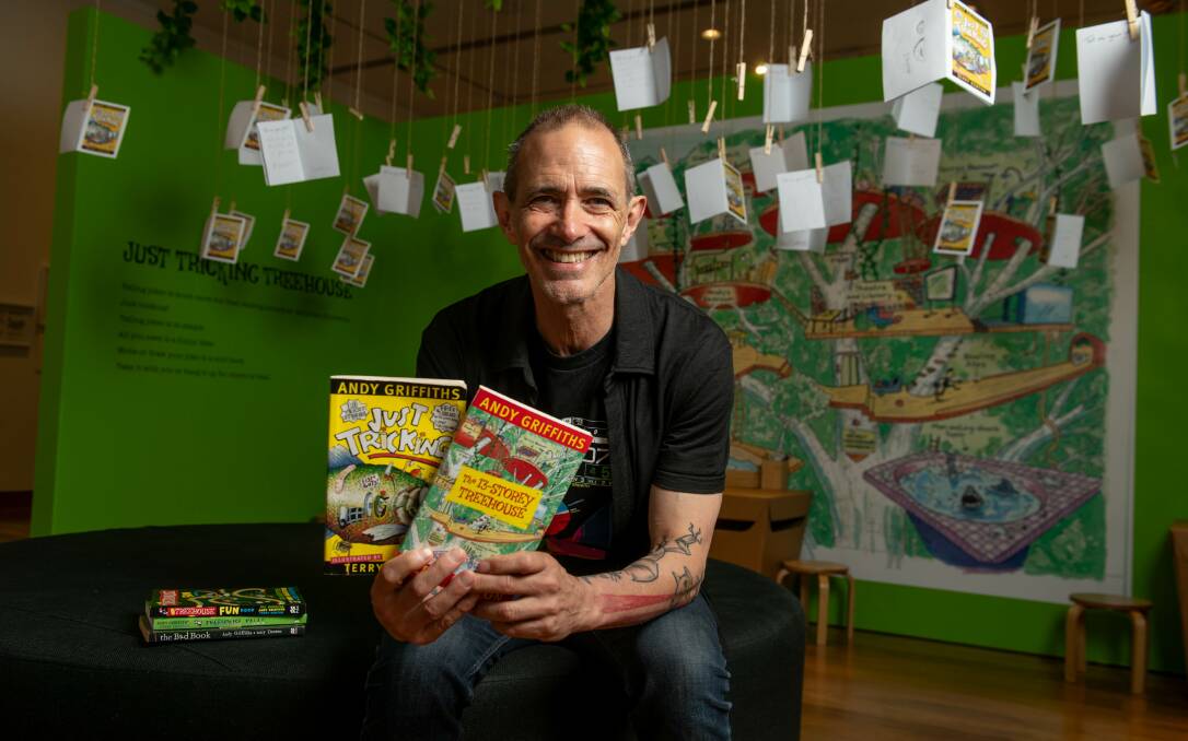 Andy Griffiths with his books in front of a Treehouse story exhibit at the exhibition at Hyphen in Wodonga which runs until May 5. Picture by Tara Trewhella