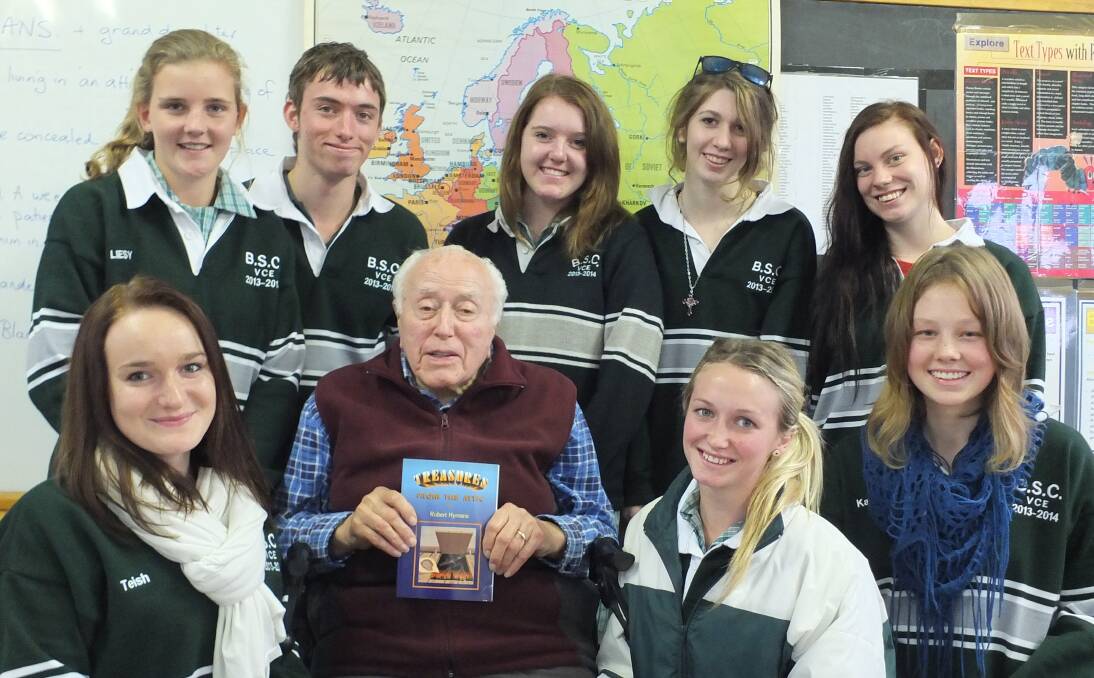 Story teller: Robert Hymans with Beechworth Secondary College students in 2013 and his book Treasures from the Attic.