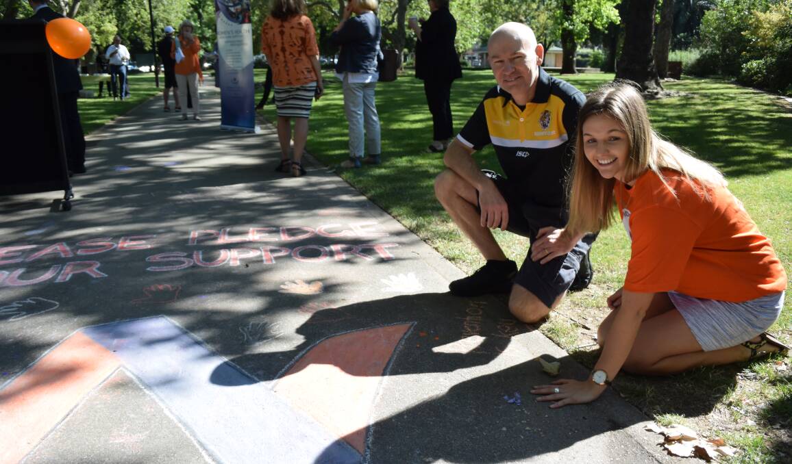 Out of the shadows: Caitlyn Hoggan and Ash Allan are backing a respect and equity approach at football clubs. They're at Wangaratta's King George V Gardens.