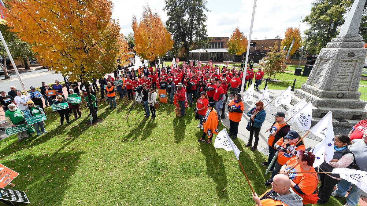 Gathering round: Union members rally at Woodland Grove in Wodonga to call for fairer rules for workers. Picture: MARK JESSER