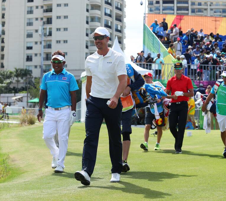 Favourite: Swede Henrik Stenson after teeing off with Thongchai Jaidee of (Thailand) and Rafa Cabrera Bello (Spain).