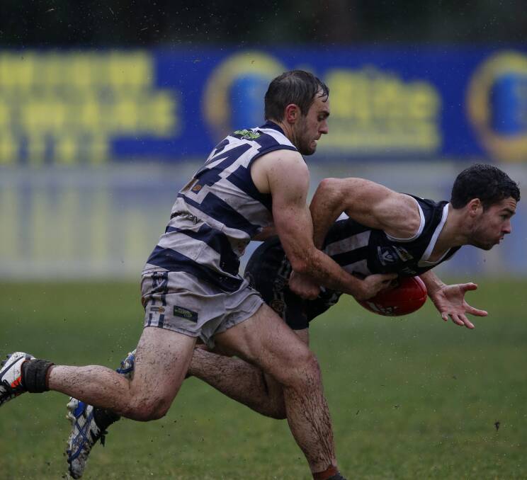 CAUGHT: Yarrawonga's Matt Dwyer tackles Wangaratta's Jack Amery. Saturday's loss all but ended the Magpies' finals chances. Picture: MARK JESSER