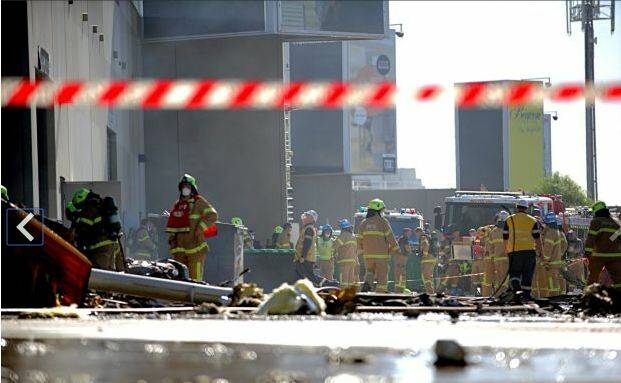 Firefighters at the scene in Essendon. Photo: Jason South.