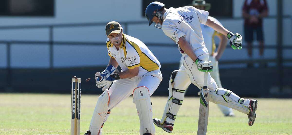 CLOSE CALL: Tallangatta wicketkeeper David Bremner almost completes a run out in the match against Wodonga. The home team declared nine down after only 65 overs.
