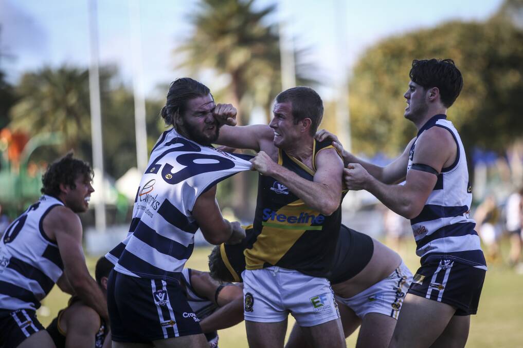 COP THAT: Albury's Chris Hyde (centre) and Yarrawonga's Connor Hargreaves come to grips in the Tigers' five-point win. Picture: JAMES WILTSHIRE