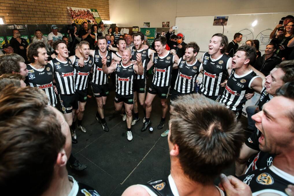 PIES PARTY: Wangaratta's Matt Kelly leads the club in their team song
after a storming last quarter fightback against Yarrawonga.
Picture: JAMES WILTSHIRE
