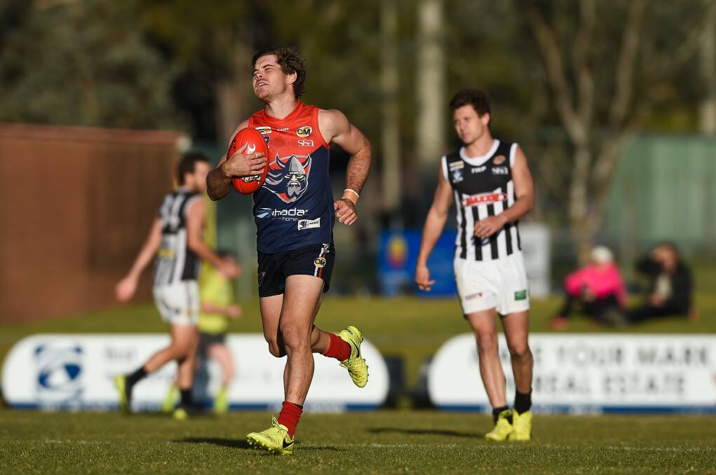 CRUCIAL INJURY: Wodonga Raiders' Brodie Filo feels the pain of a knee injury against Wangaratta. The club will be sweating on its extent. Picture: MARK JESSER