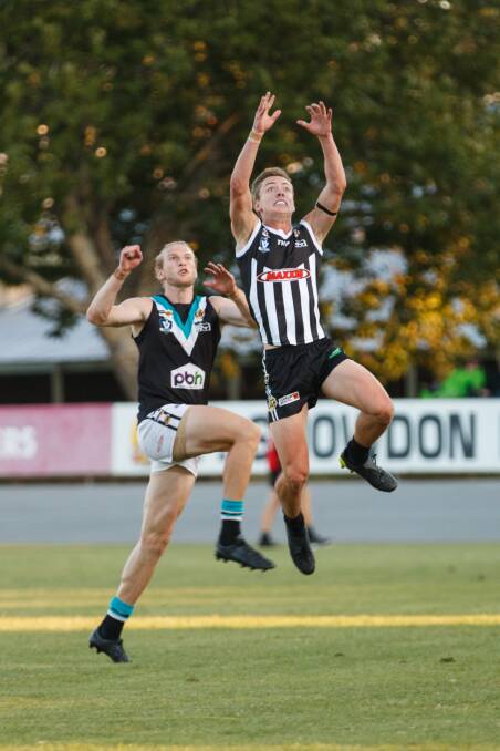 FLYING HIGH: Wangaratta's Riley Smart is in an ideal position to mark against Lavington. Pictures: WANGARATTA CHRONICLE