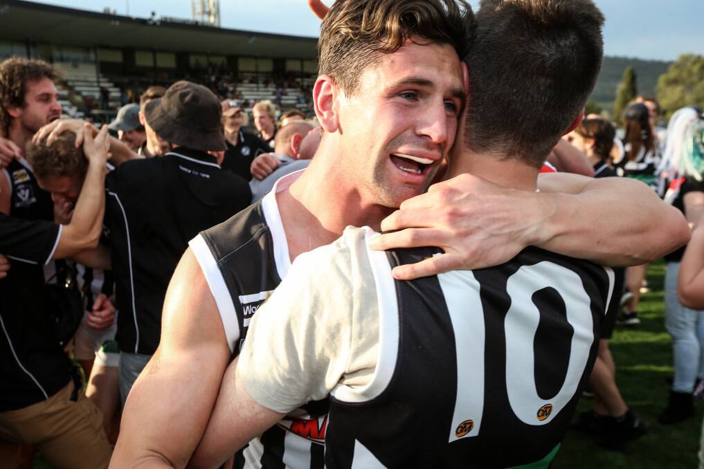 Mat Grossman celebrates the Pies' shock win over Albury in the grand final.