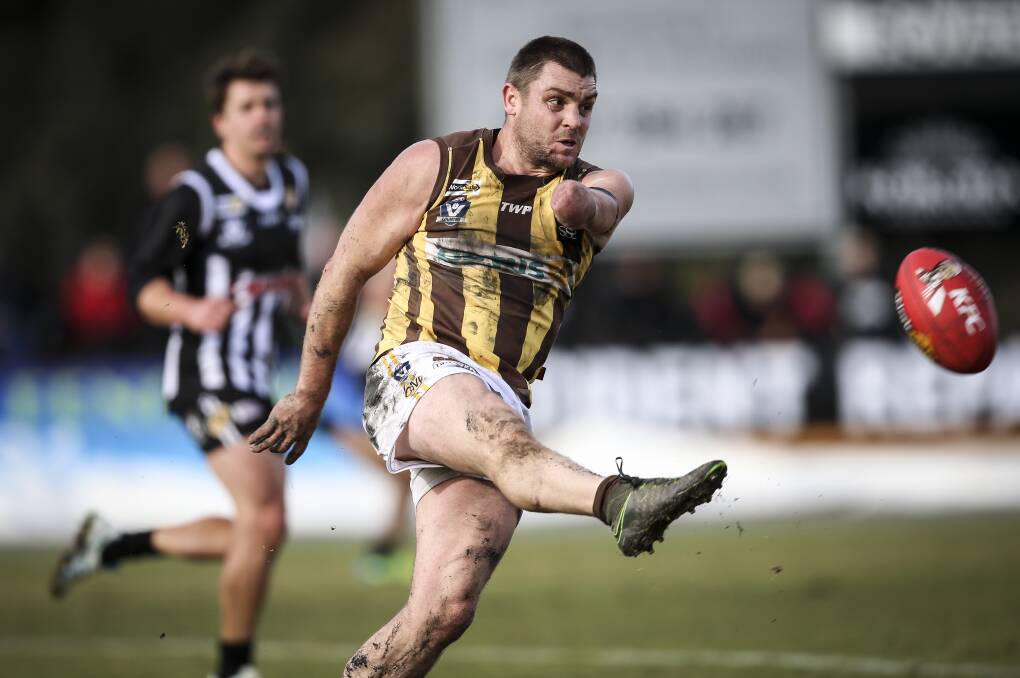 Sam Carpenter drives his team forward against Wangaratta last month. Carpenter has been reappointed co-coach with Ross Hill.