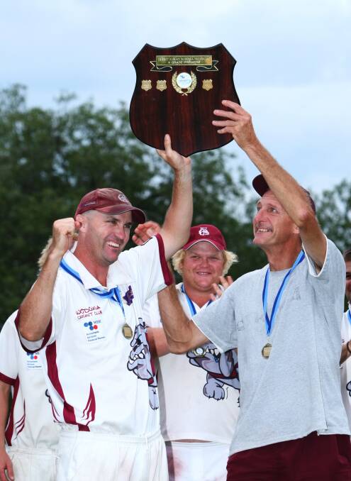 Robbie Jackson (left) and coach Andy Gibson after the pulsating 2009-10 grand final win by 17 runs. Jackson made a superb 92. 
