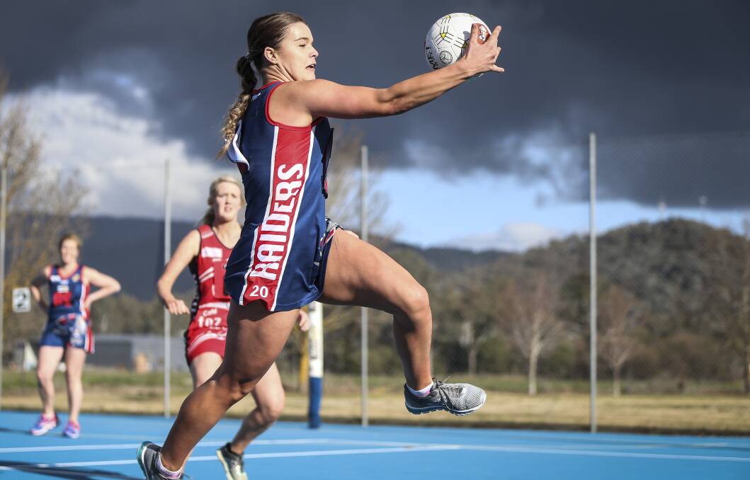 STRETCHED: Wodonga Raiders' Brooke Pryse shows her athleticism in the two-goal loss to Myrtleford. Pictures: JAMES WILTSHIRE