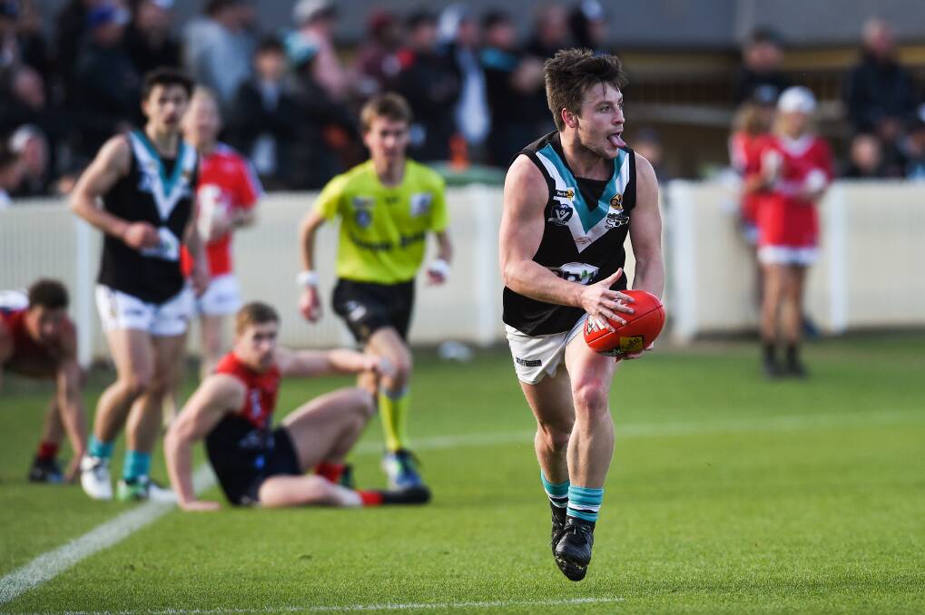 PANTHERS POWER: Lavington's Hayden Singe lets it all hang out against
Wodonga Raiders in the club's seven-goal elimination
final win. Picture: MARK JESSER