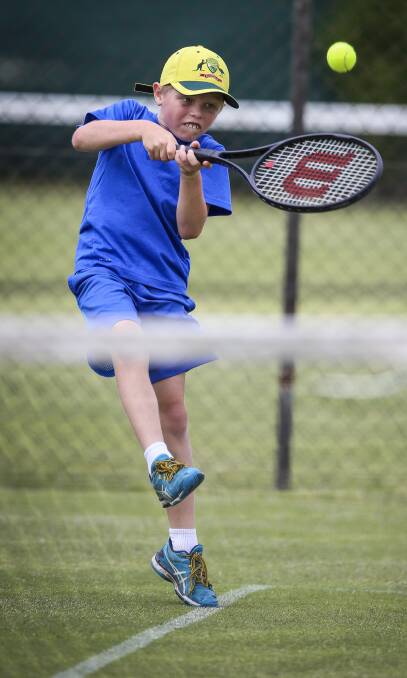 GREAT EFFORT: Charlie Smith, 9, puts everything into his backhand during Sunday's junior tournament in Albury. Picture: JAMES WILTSHIRE