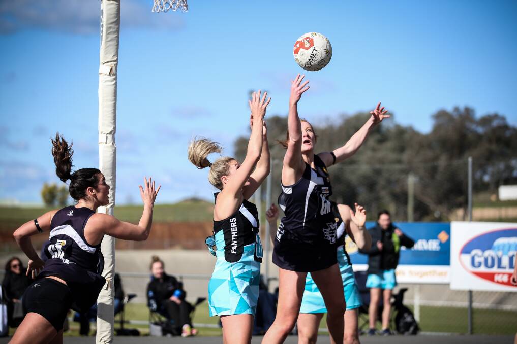FULL STRETCH: Yarrawonga's Hannah Symes strains to keep the ball away from Lavington's attack. Pictures: JAMES WILTSHIRE