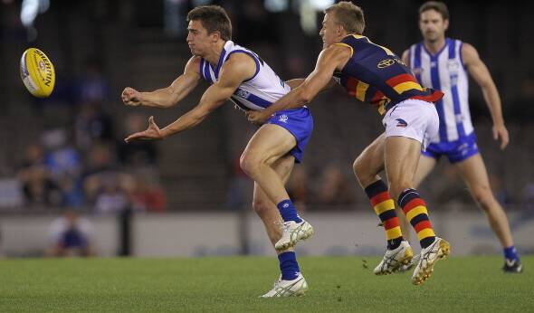 STAR SIGNING: Wangaratta recruit Ben Speight, tackled here by Adelaide's Nathan Van Berlo in 2011, says his best football is ahead of him. Picture: HAMISH BLAIR
