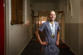 Albury High School student Sienna Toohey with her medals from the NSW Open Swimming Championships. Picture by James Wiltshire