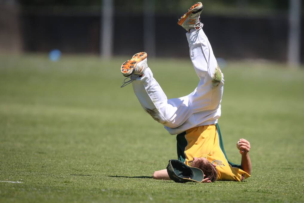 MARVELLOUS CATCH: Tallangatta's Curtis Stephens takes a tumbling catch to dismiss Wodonga batsman Jack Gilbee. Pictures: JAMES WILTSHIRE