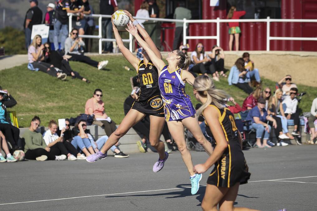 FLYING HIGH: Ovens and Murray's Kate Yensch (left) and Goulburn Valley's Belinda Lees battle for possession. Pictures: JAMES WILTSHIRE