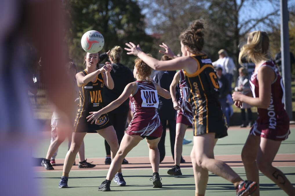 THROUGH TRAFFIC: Ovens and Murray weaves a pass around the opposition during their 17 and under clash in Albury. The titles attracted 46 teams.