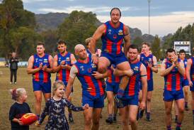 Brenton Surrey is chaired off the ground in his 300th match after the Bushies' big win over Kiewa-Sandy Creek on Saturday. Picture by Beechworth Football Club
