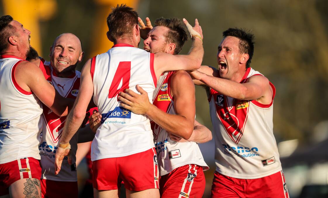 The Swans celebrate last year's epic grand final victory over Kiewa-Sandy Creek. PIcture by James Wiltshire