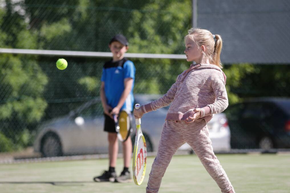 EYE ON THE BALL: Ella Terlich, 7, fires back a return during the opening week of Albury junior pennant at the grasscourts. Picture: JAMES WILTSHIRE