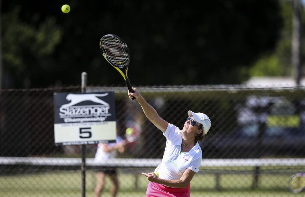 WHACK: Di Wurtz connects with a big serve during Tuesday ladies tennis at Albury. Picture: JAMES WILTSHIRE
