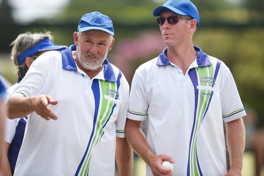 ALL AT STAKE: Corowa Civic's Ian Lewis and Danny Webb talk tactics during the side's elimination semi-final victory against YMGCR. Picture: JAMES WILTSHIRE