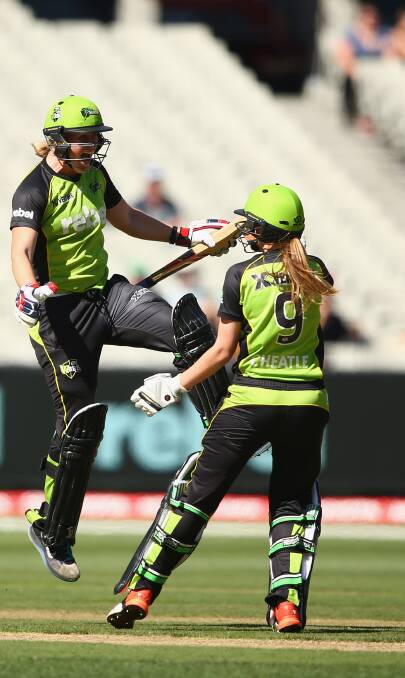 MAGIC MOMENT: Claire Koski and Lauren Cheatle celebrate after clinching the WBBL title for the Sydney Thunder last season. Picture: GETTY IMAGES