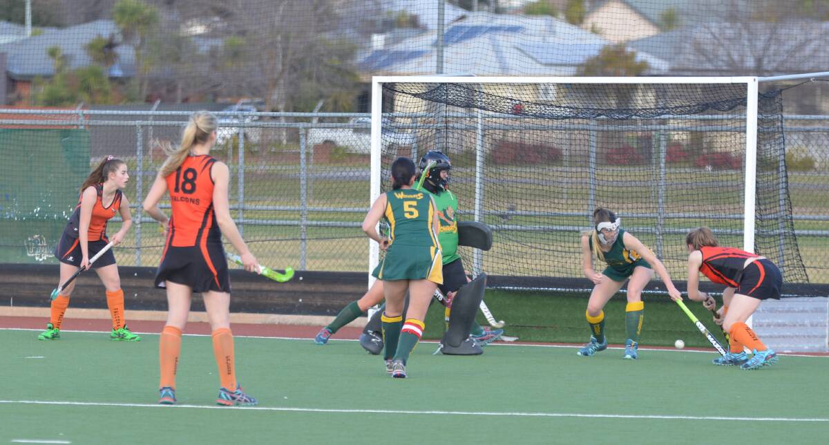 GREAT FINISH: Wombats defender Eryn Norie scrambles down back as Falcons' Meghan Cockayne attacks the goal. Picture: NARELLE HAMILTON