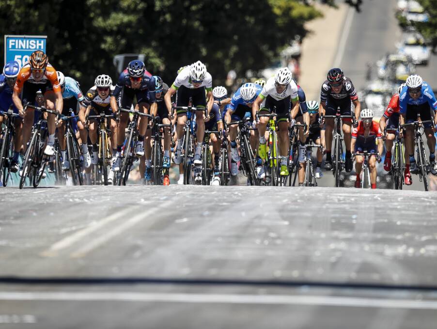 MAD SCRAMBLE: Several riders from the peloton jostle for position in a sprint to the finish on Beechworth's Camp Street to wrap up stage two of the tour.