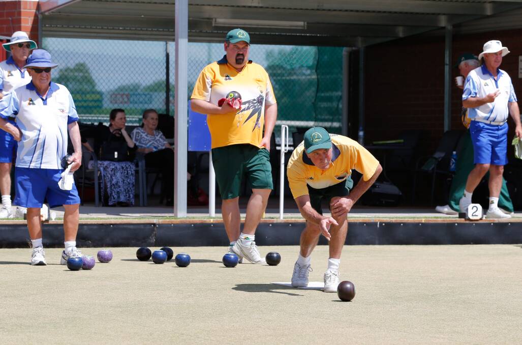 SMOOTH ACTION: Bob Gough releases the bowl as teammate Brett Furze watches on during the Hoppers' win against Commerical on Saturday. Picture: SIMON BAYLISS