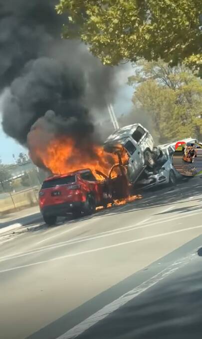 A red SUV and white dual cab ute were fully alight after a crash on Young Street on Sarurday, March 23. Picture supplied