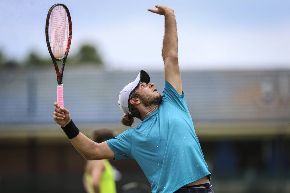 CLASS ACT: Margaret Court Cup men's singles champion Dimitri Vidin rocks back in his service motion during a tense final against Aitor Lasa. Pictures: JAMES WILTSHIRE