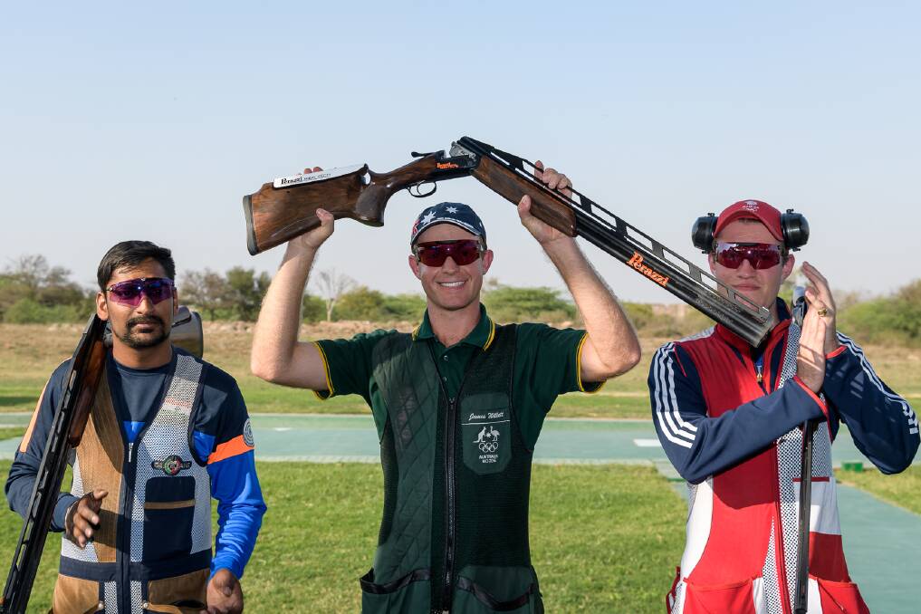 GOLDEN DAY: James Willett holds his gun aloft after claiming the opening ISSF World Cup event at New Delhi, India, this week. 