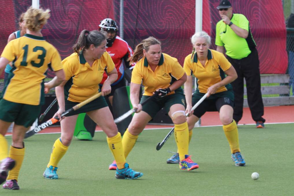 STICKING TOGETHER: Jo Hale, Kay Drummond and Glenda Langford combine for the Border Masters over 50s during the World Masters Games in New Zealand. 