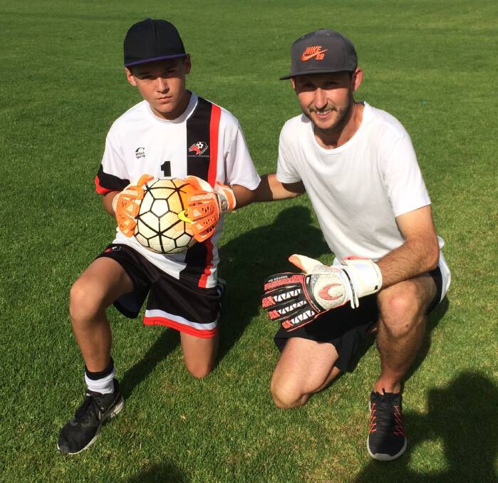 AWFA under 13 goalkeeper Justin Mercieca with Star Goalkeeper Matt Mildren.